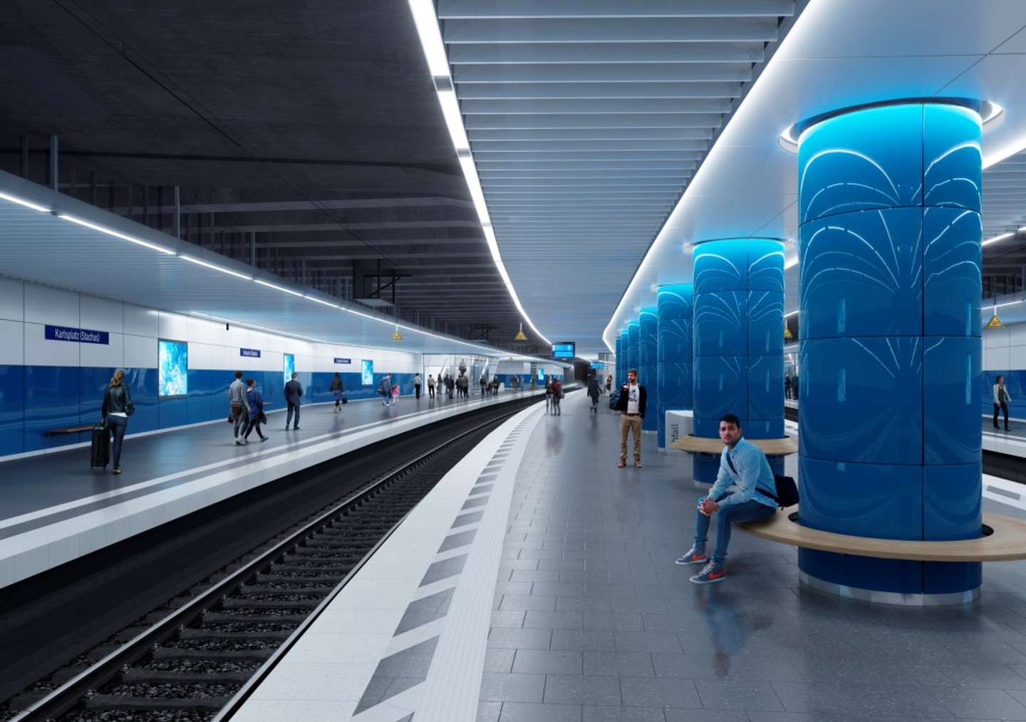 Ein Entwurf eines zukünftigen, unterirdischen Bahnsteigs mit blauen Säulen, um die Sitzgelegenheiten gebaut sind.